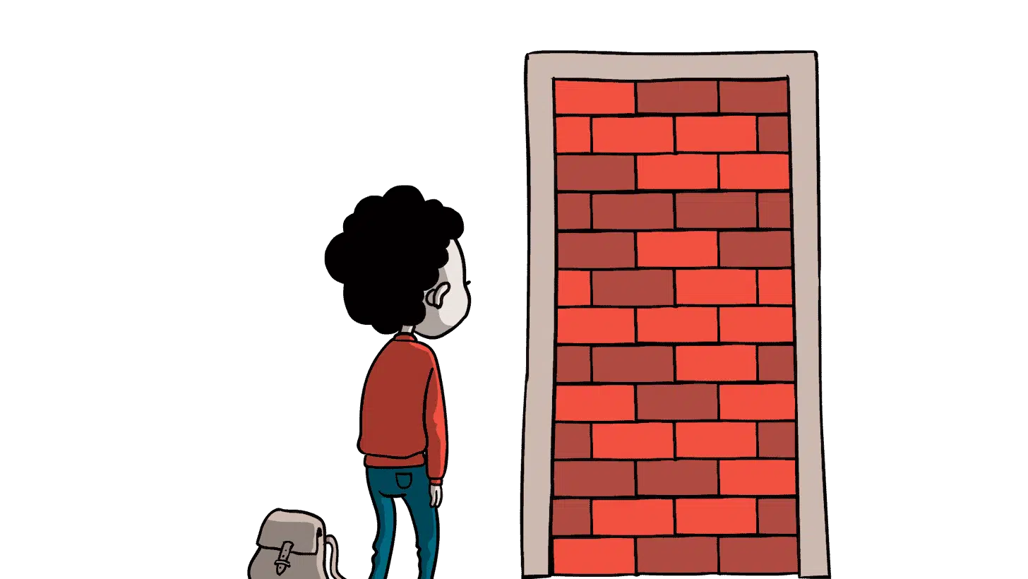 Dreng kigger ind i en dørkarm fuld af mursten